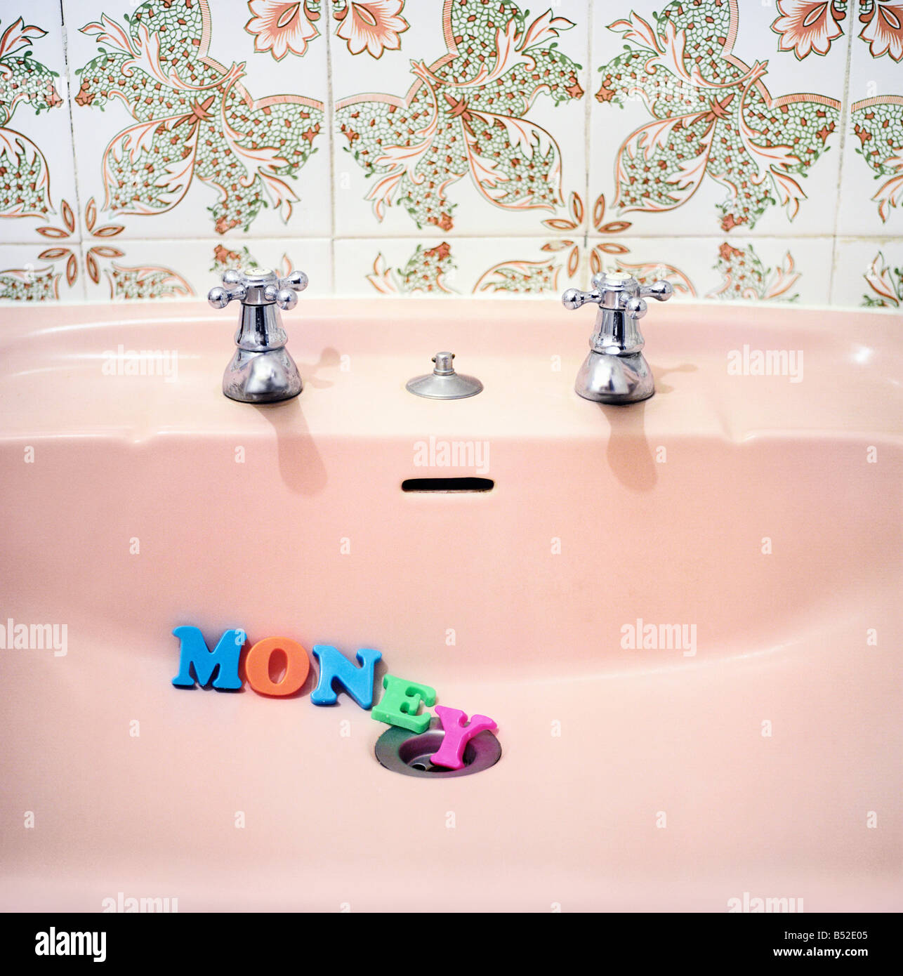 Word MONEY in the bathroom sink Stock Photo Alamy