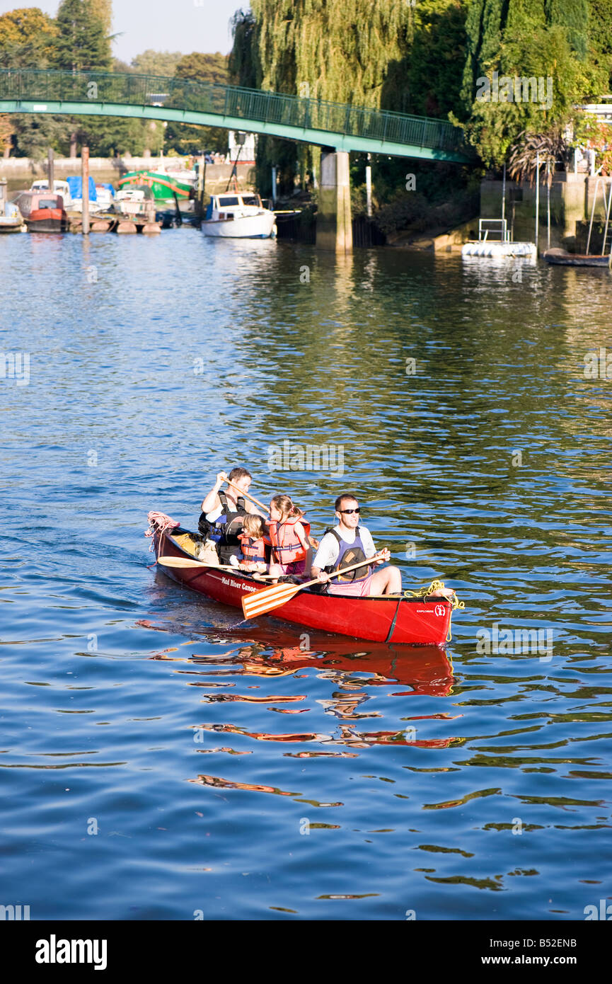 Family in a canoe on Thames River Twickenham TW10 London United Kingdom Stock Photo