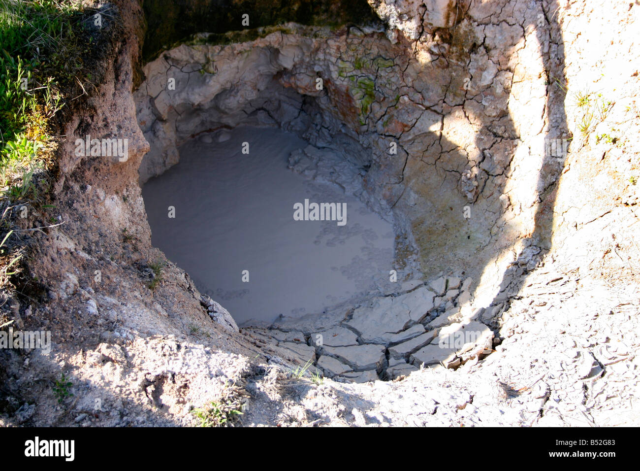 Mud Pots at West Thumb Geyser Basin hot spring containing boiling mud in Yellowstone Park in