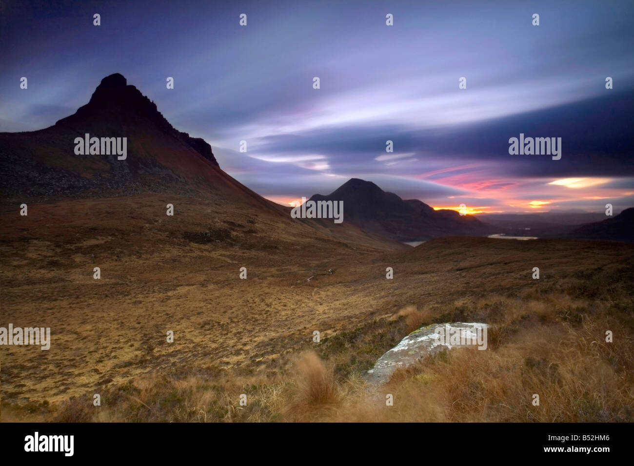 Mid winter sunrise over Stac Pollaidh (Polly) and Cul Mor Assynt region Wester Ross Scottish Highlands Stock Photo