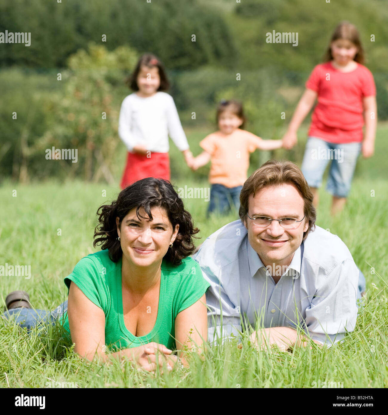 Happy and young family in a farmers field Stock Photo - Alamy