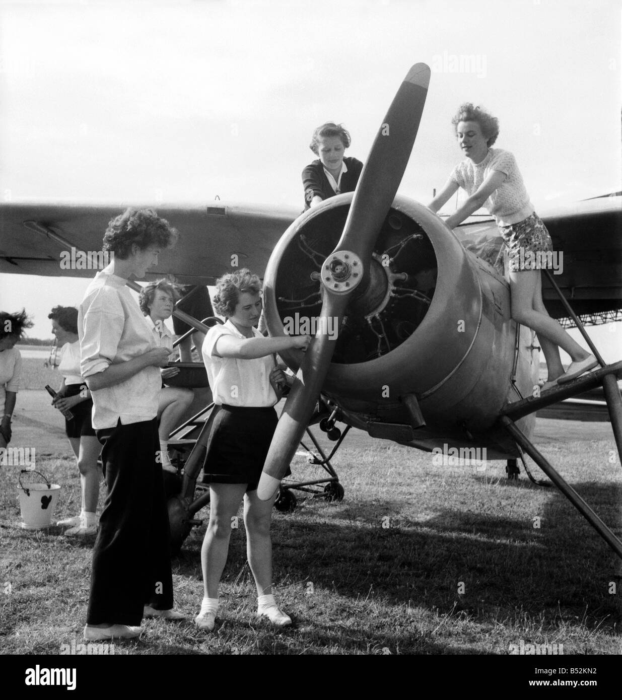 W. J. A. C. girls seen here servicing plane. August 1952 C4029 Stock Photo