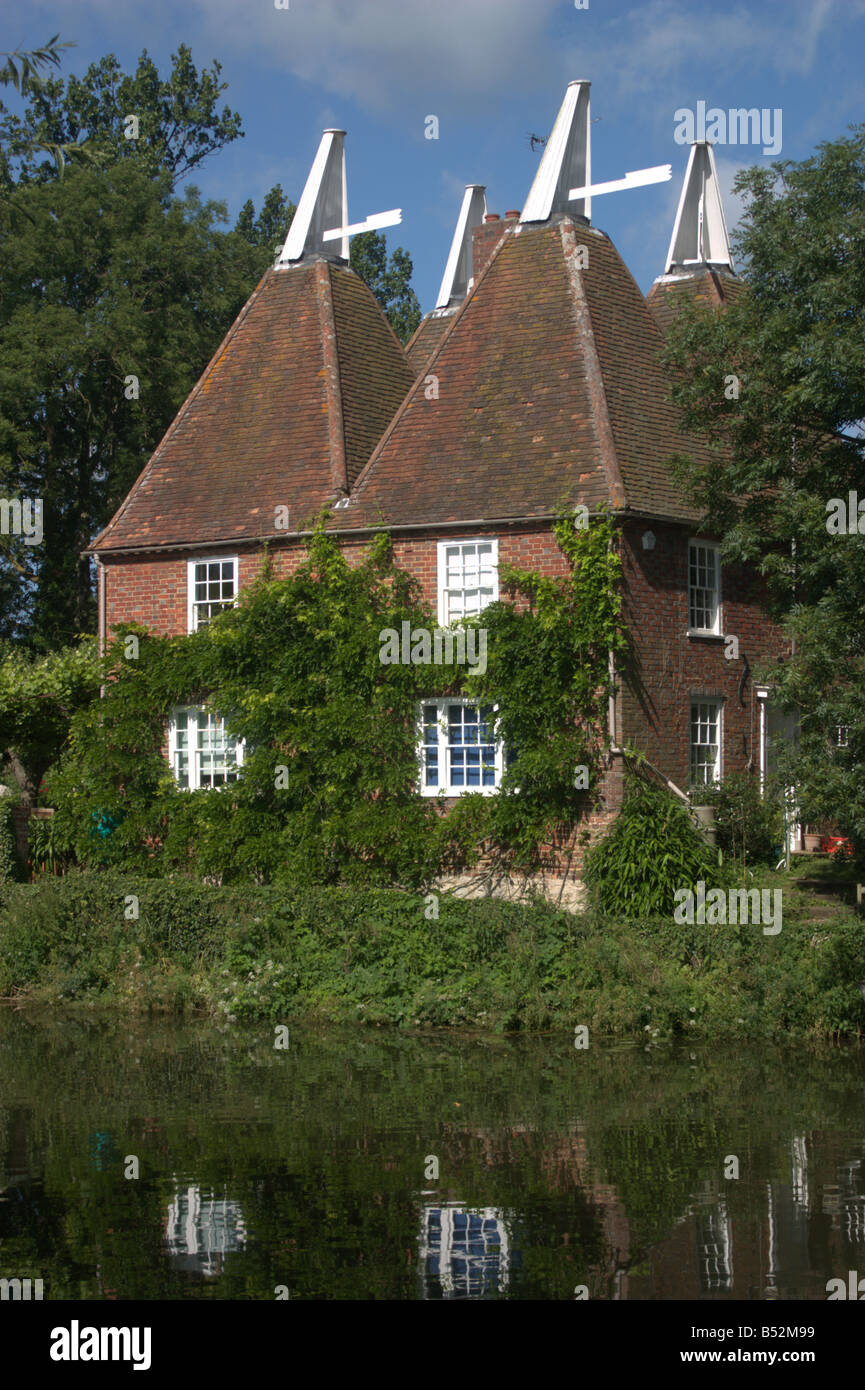 summer oast house water reflection front vine green river medway