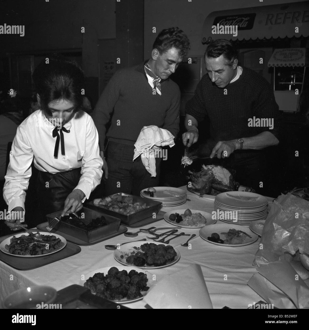 Ton up boys pensioners dinner at Eton House, Mission Hall, Eastway, Hackney. In charge of everything was Rev William Shergold, wearing flying boots with his dog collar;February 1964;S1494 19 Stock Photo