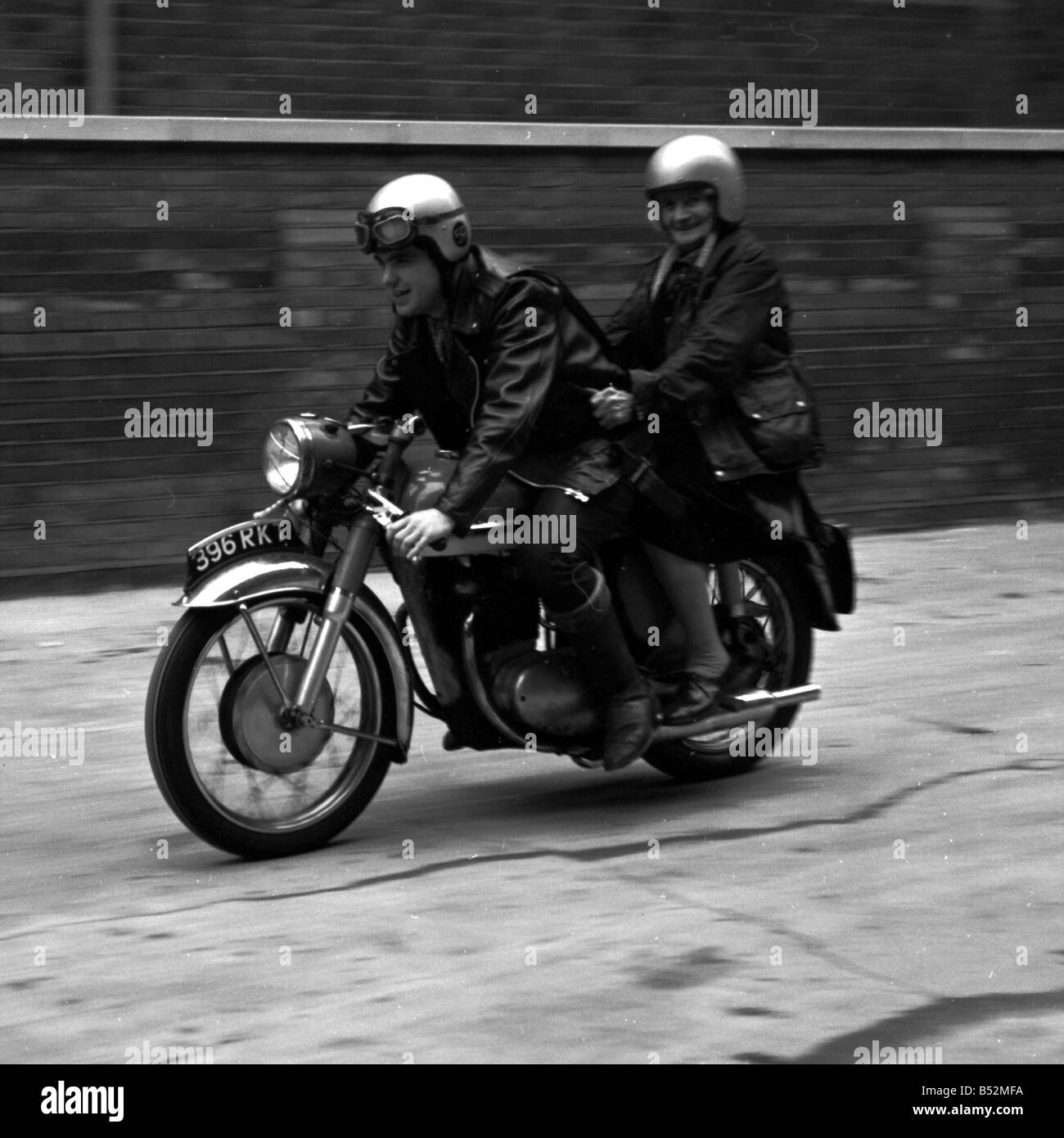 With her crash helmet on fair and square, and goggles flipped back, 80