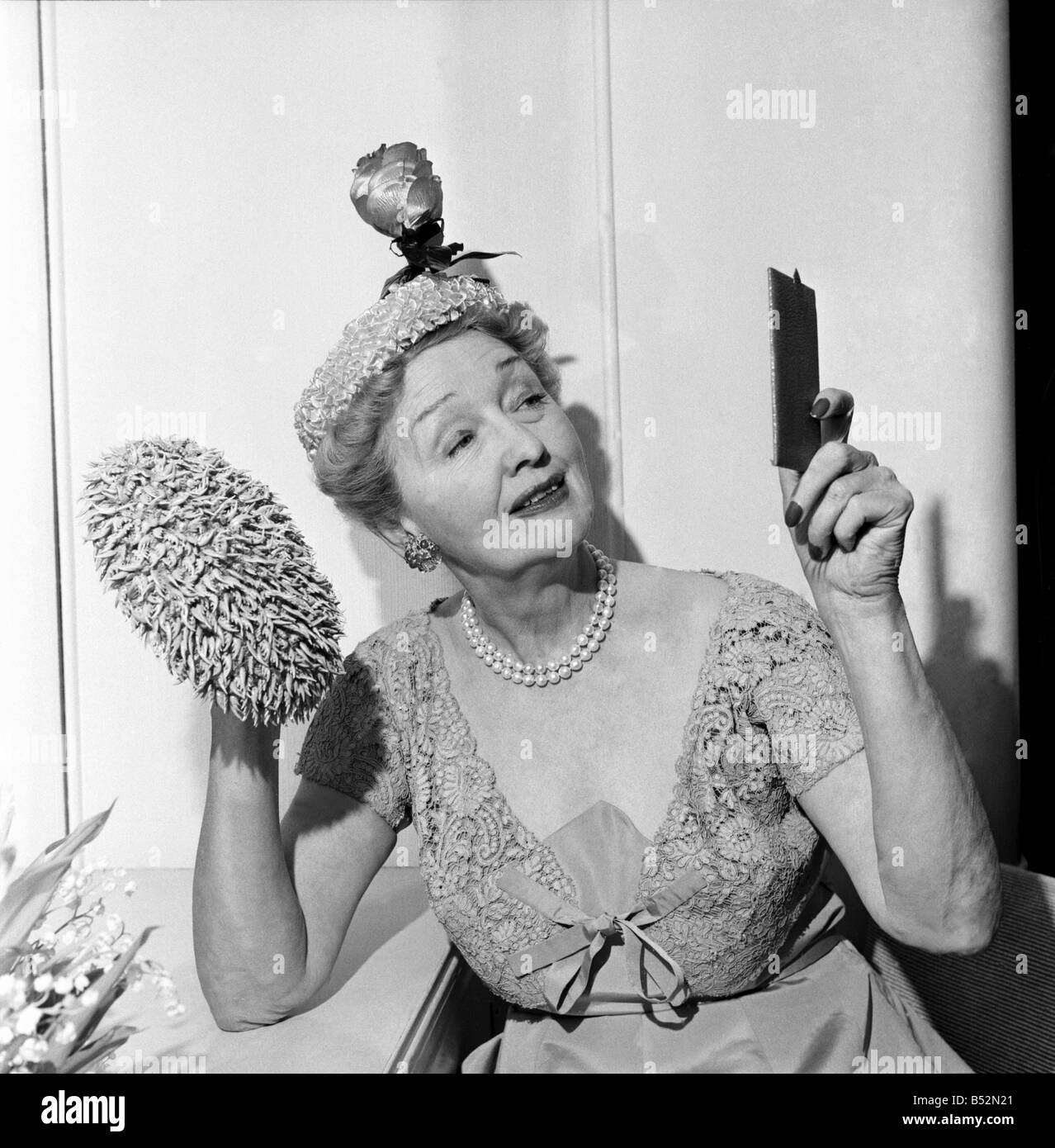 Hedda Hopper who is going to present to the Queen two of her fantastic hats. June 1953 D2958-001 Stock Photo