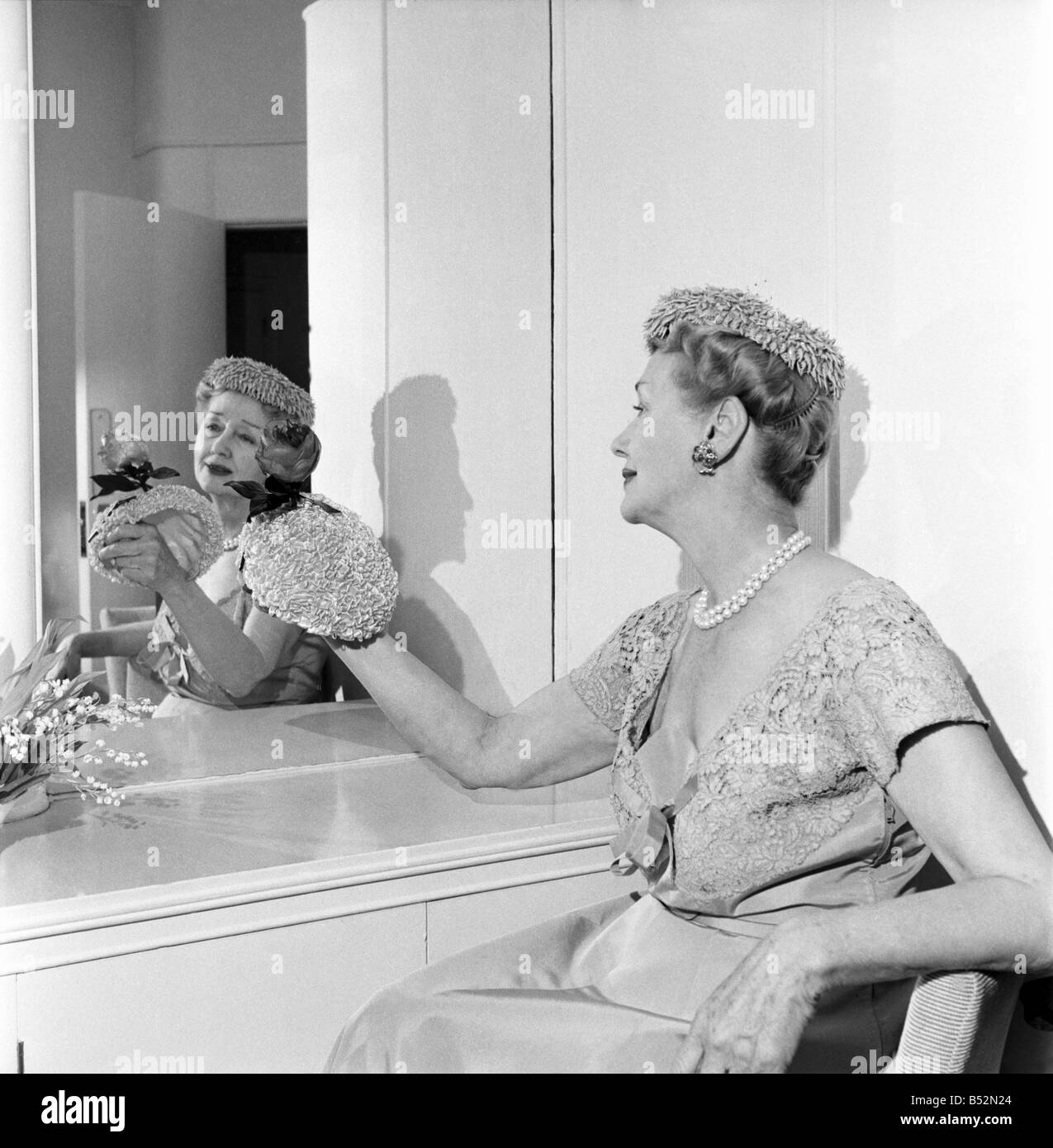 Hedda Hopper who is going to present to the Queen two of her fantastic hats. June 1953 D2958-002 Stock Photo