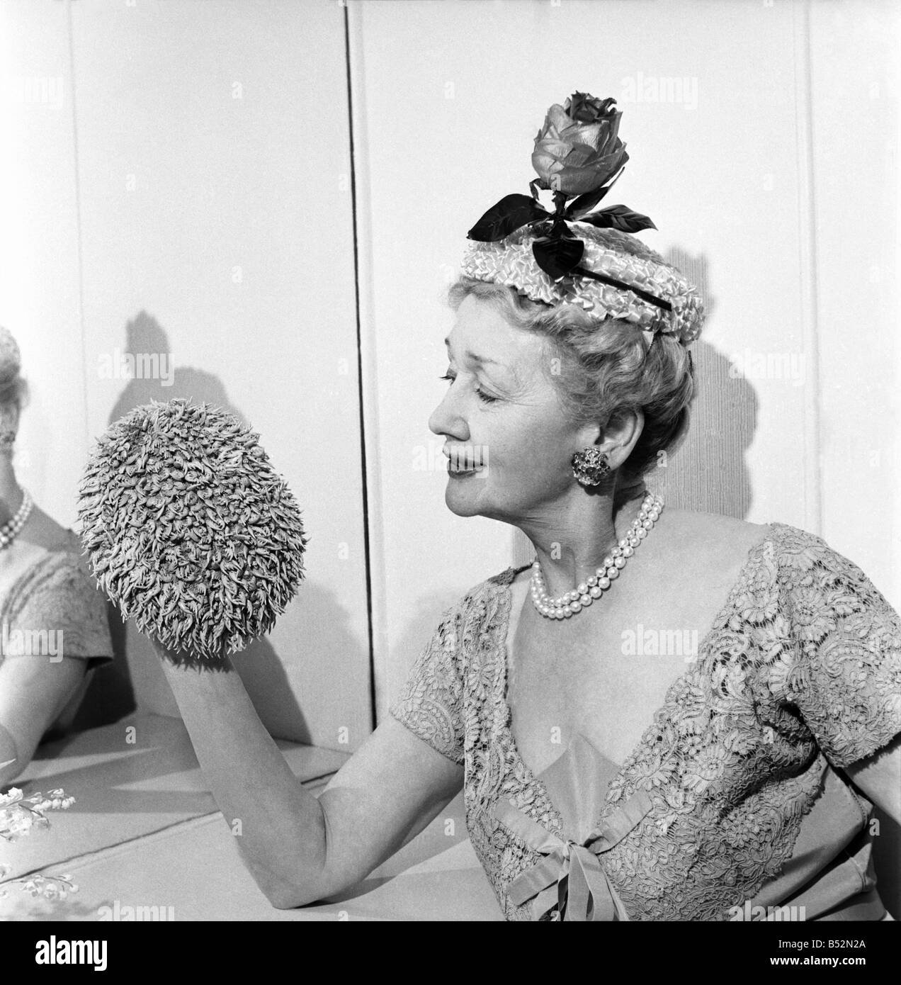 Hedda Hopper who is going to present to the Queen two of her fantastic hats. June 1953 D2958-003 Stock Photo