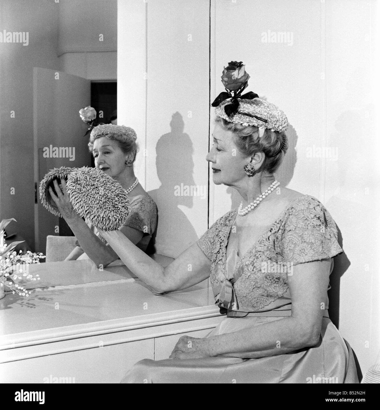 Hedda Hopper who is going to present to the Queen two of her fantastic hats. June 1953 D2958-004 Stock Photo