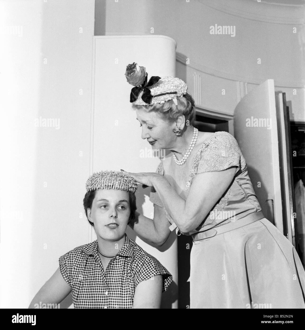 Hedda Hopper who is going to present to the Queen two of her fantastic hats. June 1953 D2958 Stock Photo