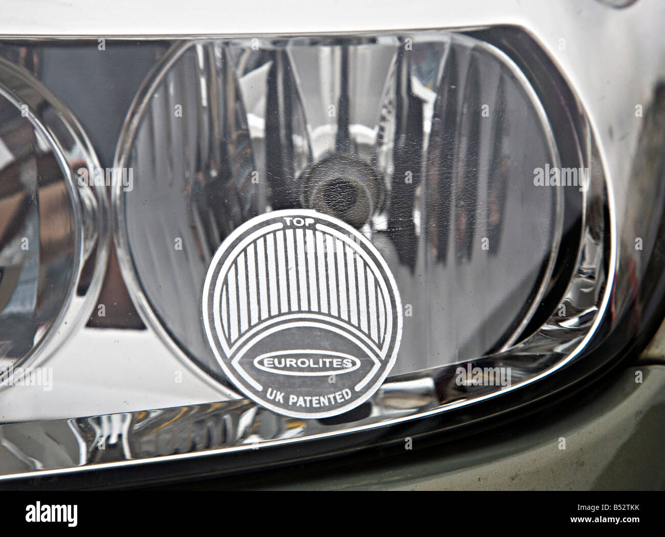 Beam deflector on car headlight ready for driving on the right in Europe UK Stock Photo