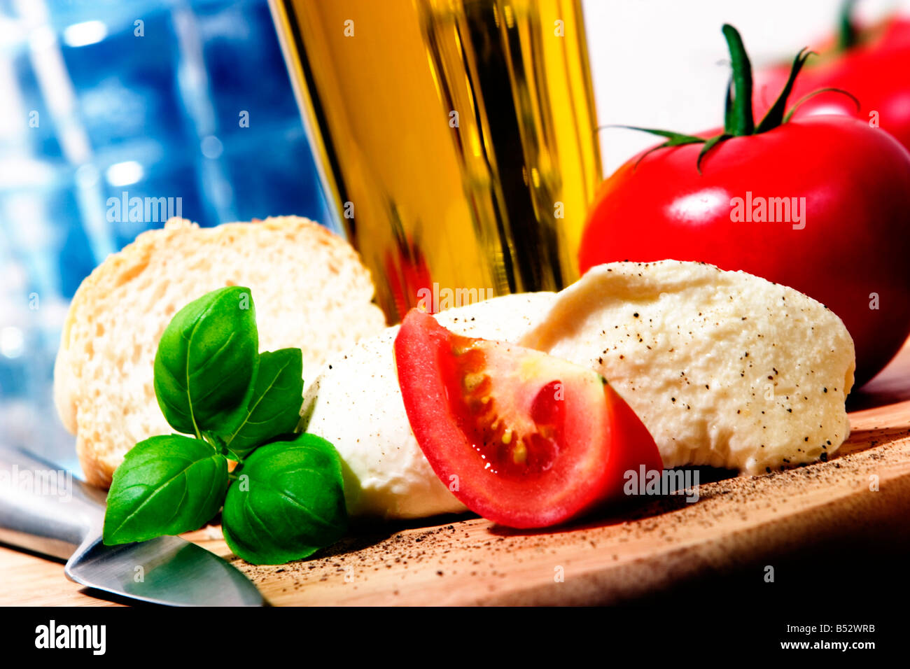 Mozzarella, tomatos, olive oil, basil Stock Photo Alamy