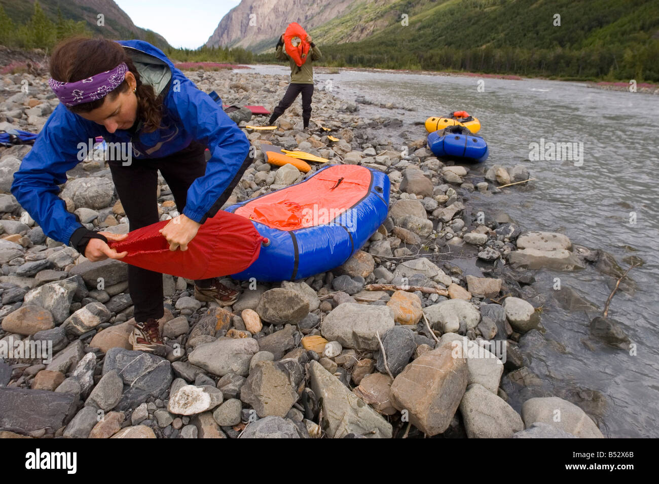 Two females getting ready for a pack rafting trip down Eagle River in ...