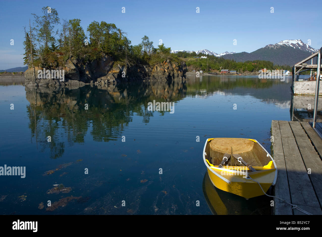 Small skiff tied to boat dock at Halibut Cove, Alaska in summer Stock Photo Alamy