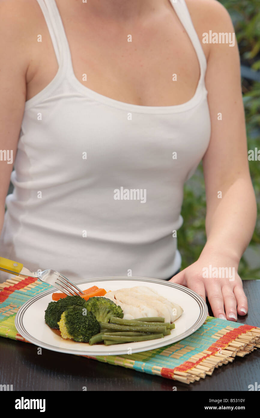 Young woman eating baked beans hi-res stock photography and images - Alamy