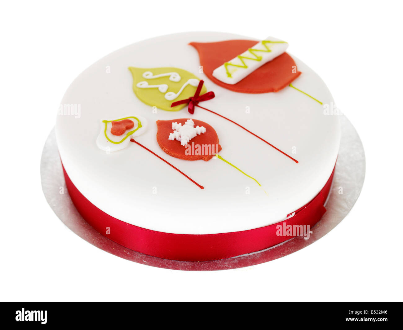 Traditional Rich Fruit Cake With White Icing Decorated For Christmas Isolated Against A White Background With No People And A Clipping Path Stock Photo