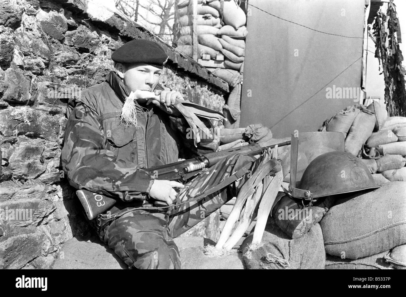 Northern Ireland 1972. Gunner Michael Davies of the army light defence regiment in Londonderry enjoys a leek to celebrate St Davids Day. 72-3401-001 Stock Photo