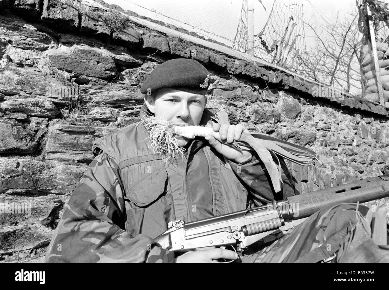 Northern Ireland 1972. Gunner Michael Davies of the army light defence regiment in Londonderry enjoys a leek to celebrate St Davids Day. 72-3401 Stock Photo