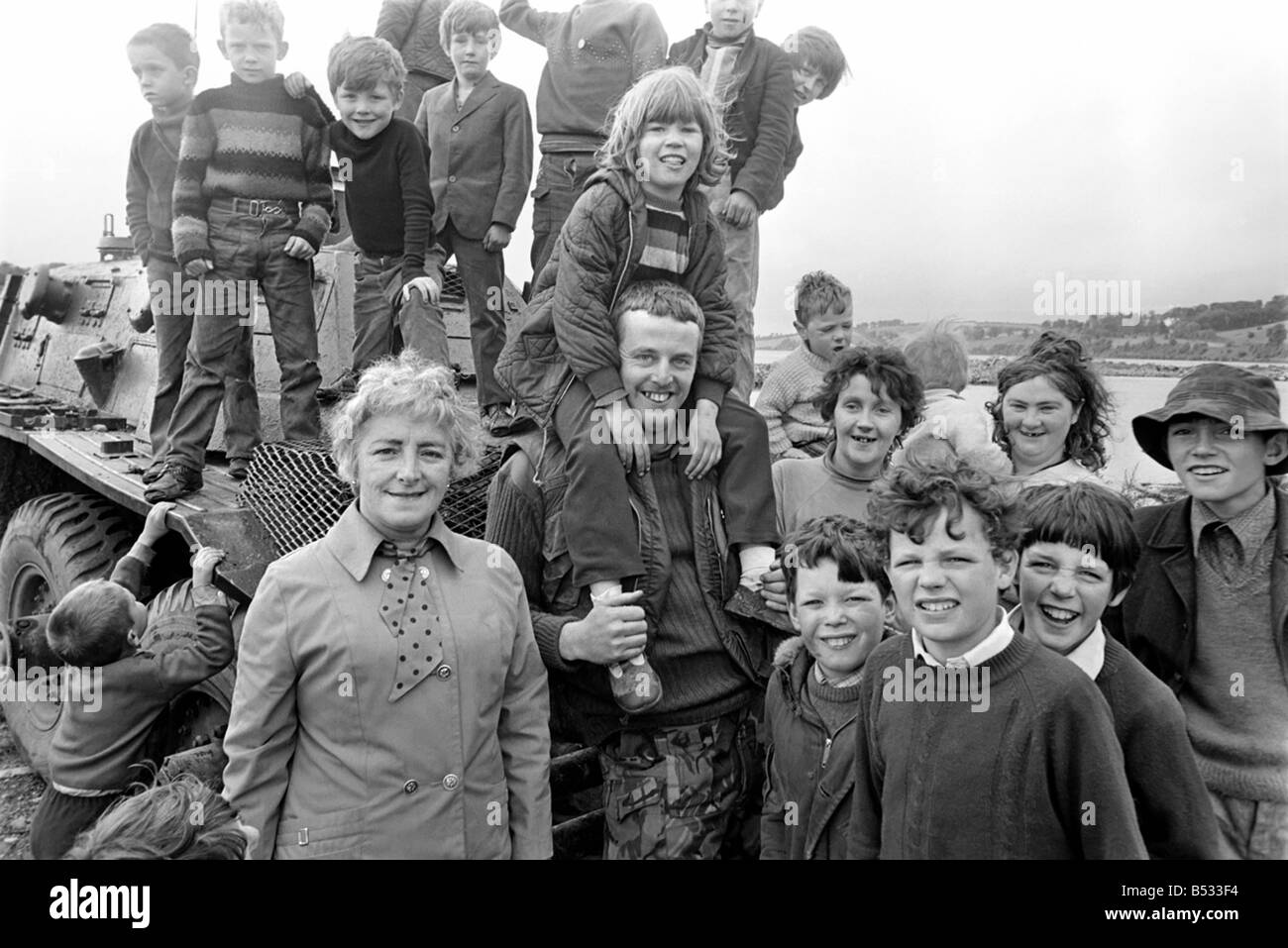Northern Ireland June 1972. Children and soldiers play at the army base on the Foyle Road. The army were in the process of abandoning the camp. June 1972 72-7009-004 Stock Photo