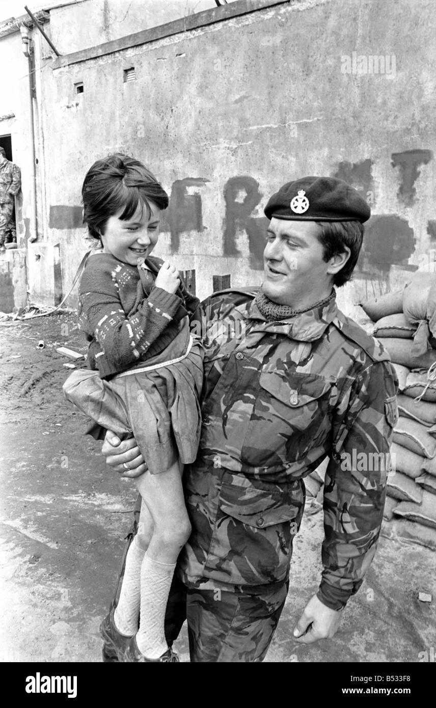 Northern Ireland June 1972. Children and soldiers play at the army base on the Foyle Road. The army were in the process of abandoning the camp. June 1972 72-7009-005 Stock Photo