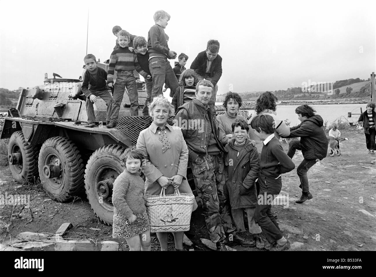 Northern Ireland June 1972. Children and soldiers play at the army base on the Foyle Road. The army were in the process of abandoning the camp. June 1972 72-7009-006 Stock Photo