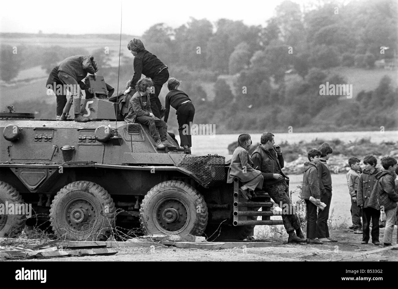 Northern Ireland June 1972. Children and soldiers play at the army base on the Foyle Road. The army were in the process of abandoning the camp. June 1972 72-7009 Stock Photo