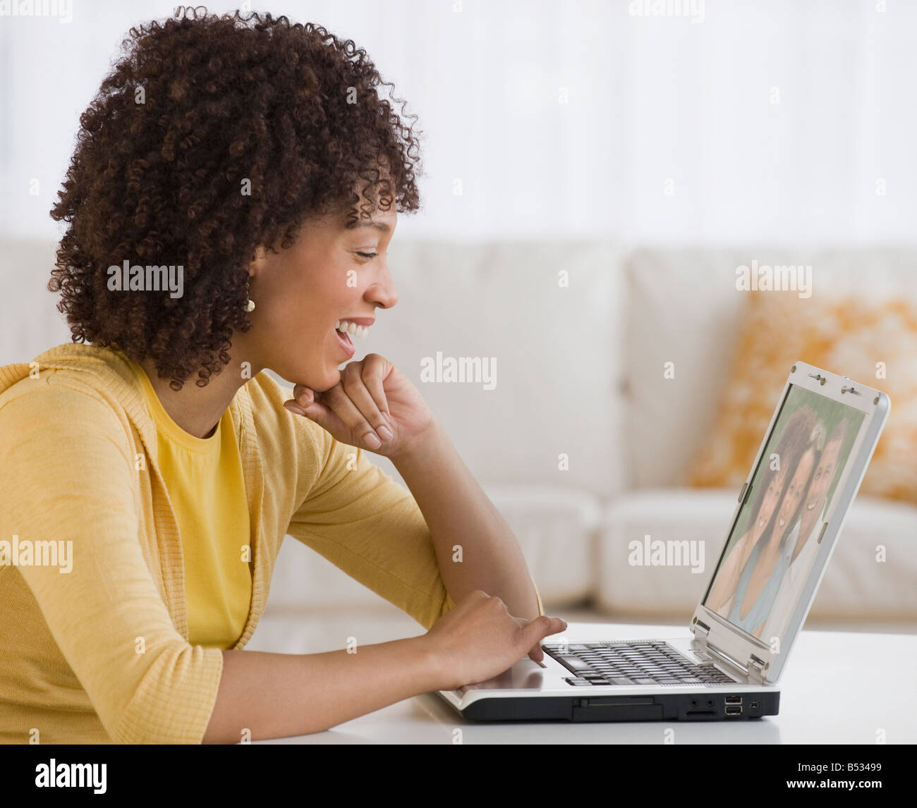 African woman looking at laptop Stock Photo - Alamy