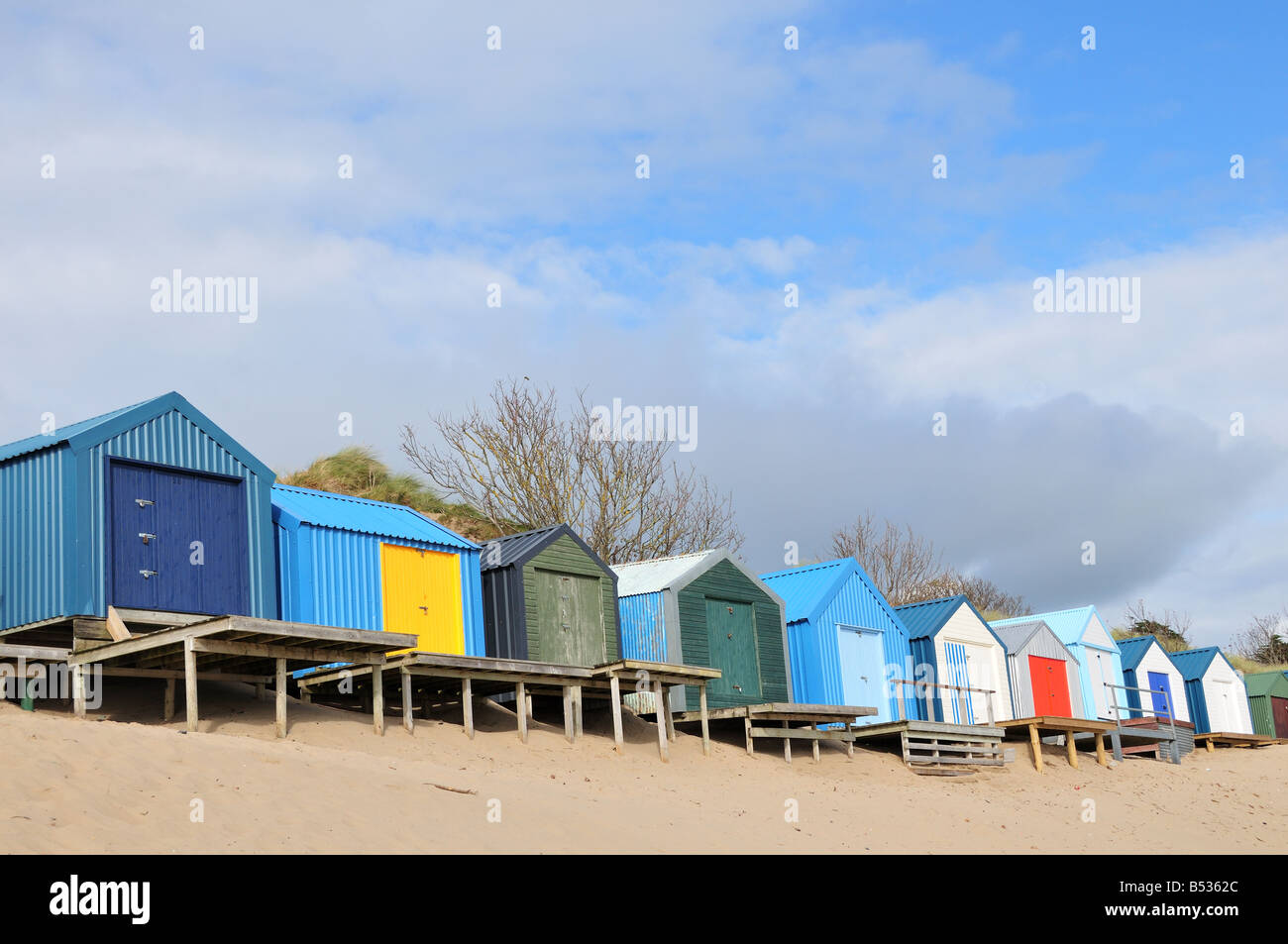 Painted beach huts on Morfa Gors Beach Abersoch Llyn Peninsula Gwynedd Wales Stock Photo