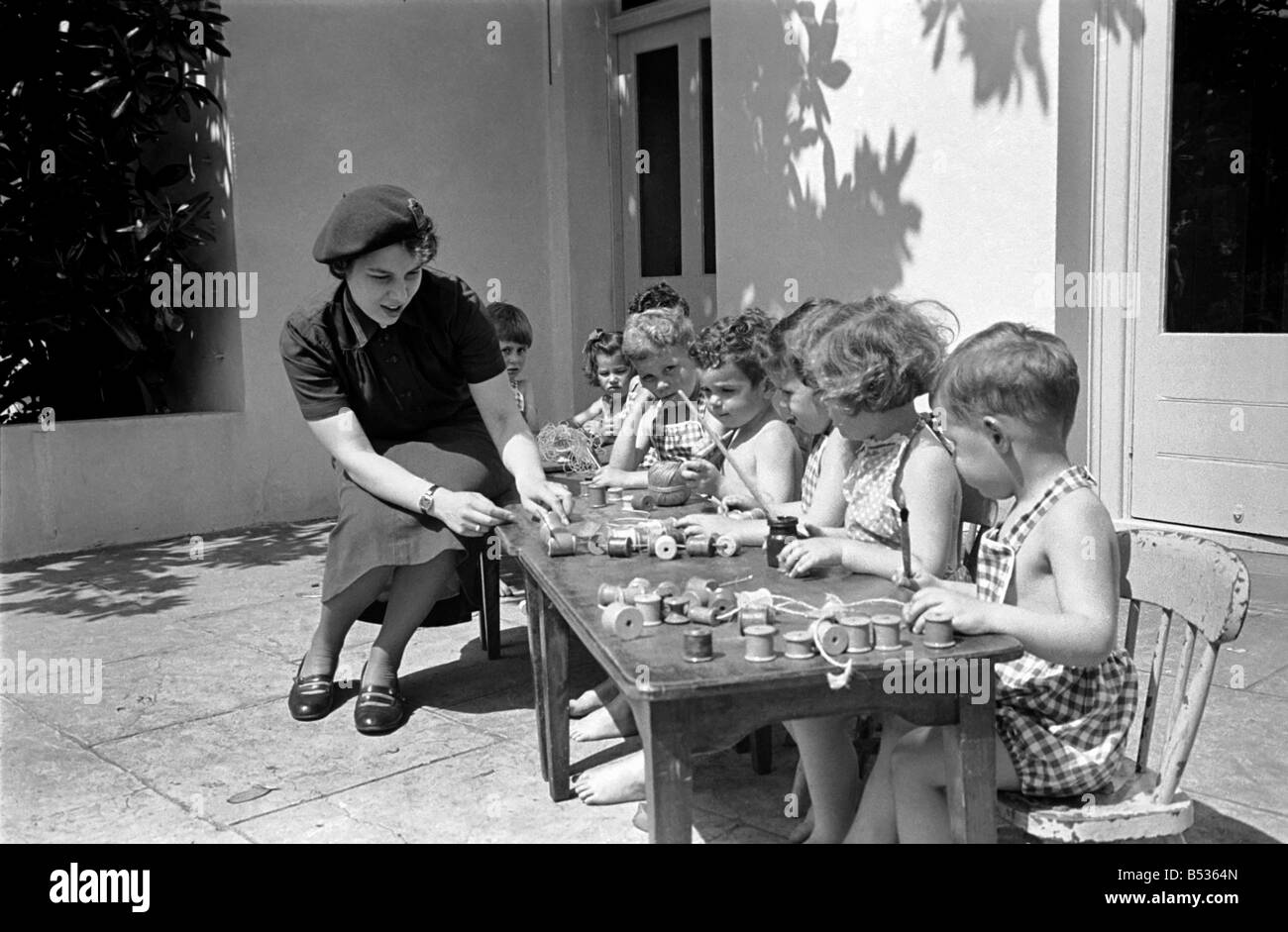 Children cool down at the Hollyshaw residential nursery. June 1950 O24480-002 Stock Photo