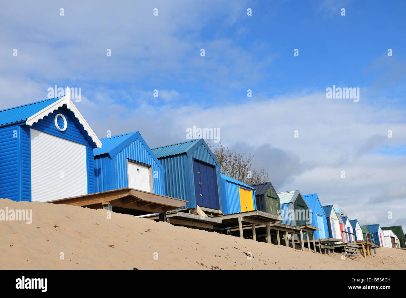 Colourful beach huts on Morfa Gors Beach Abersoch Llyn Peninsuta Gwynedd Wales Stock Photo