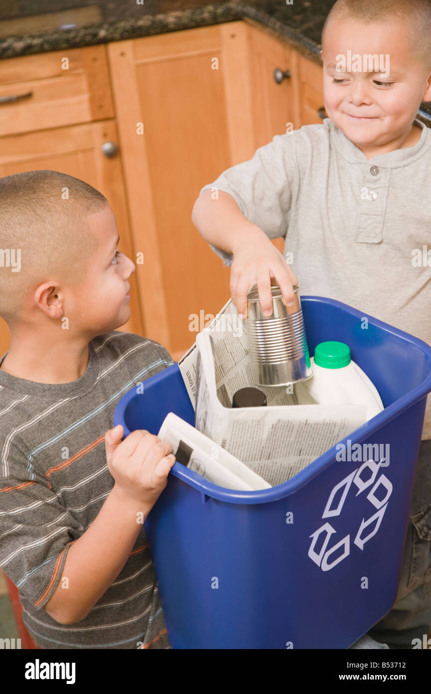 Hispanic brothers recycling Stock Photo Alamy