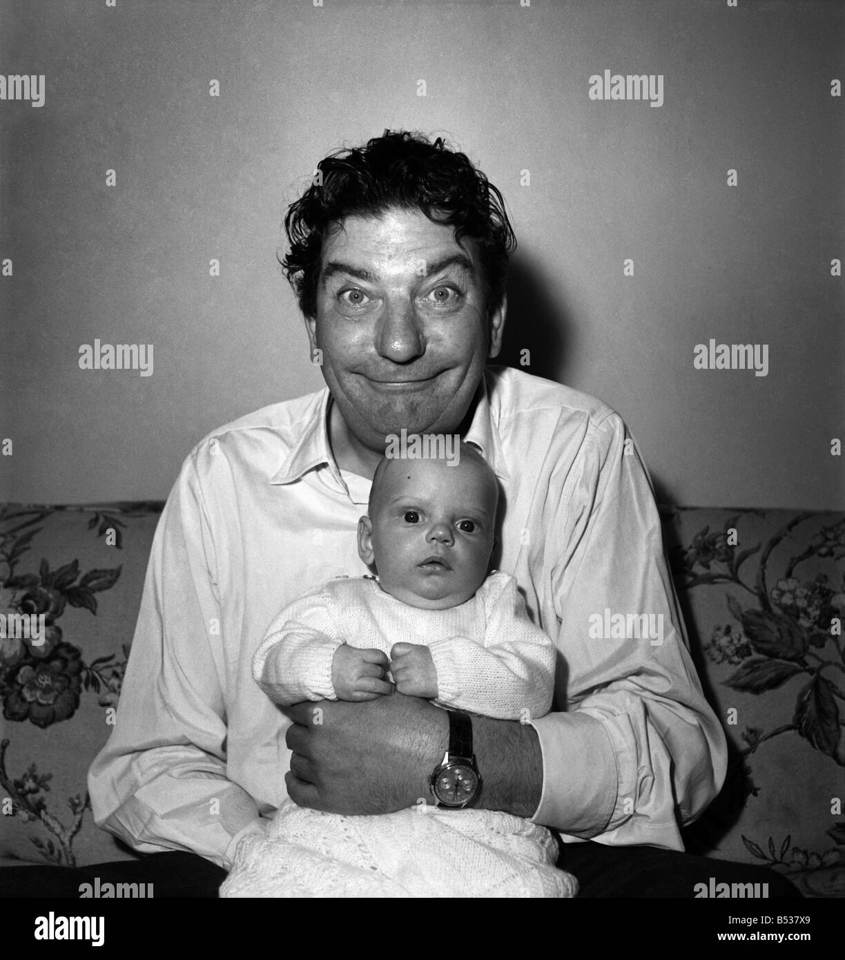 Sid Field with baby. September 1948 O14844 Stock Photo