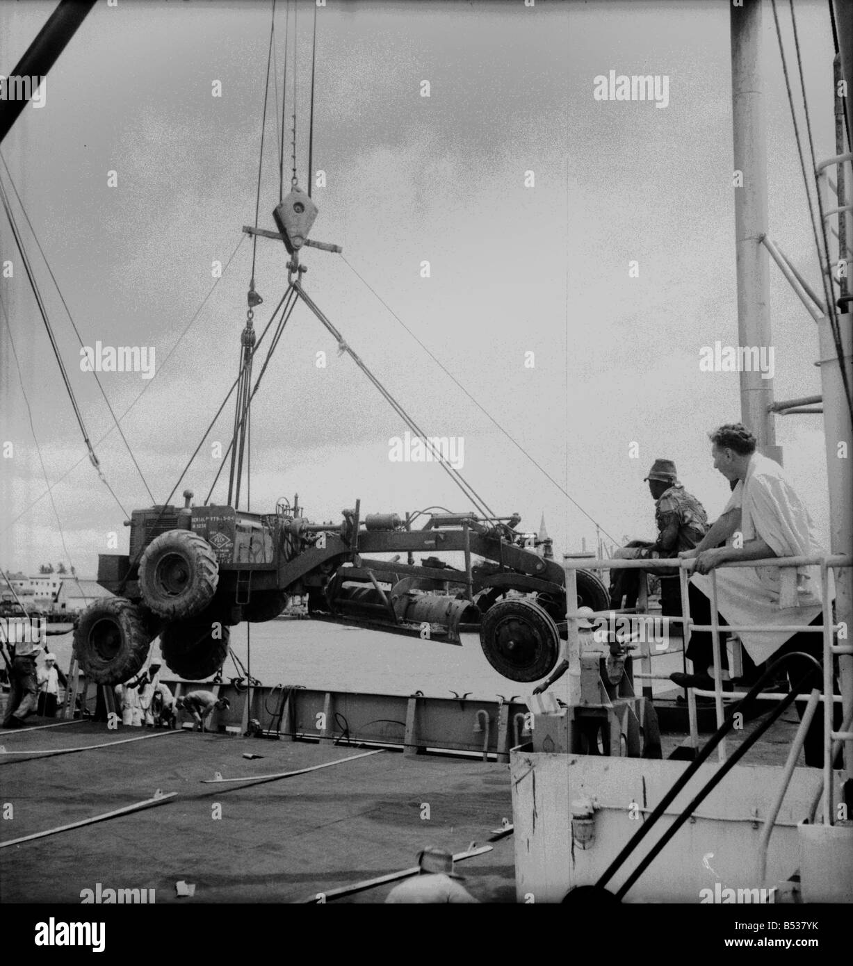 East African Groundnuts Scheme. Loading caterpillar tractors and road