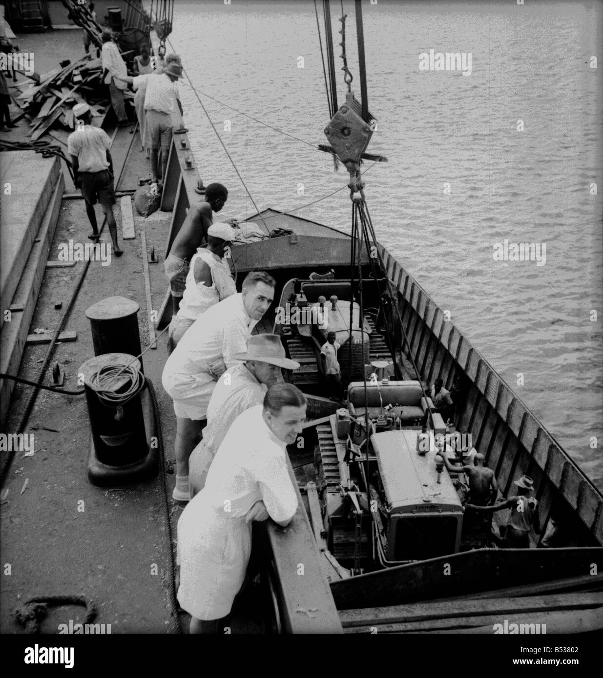 East African Groundnuts Scheme. Loading caterpillar tractors and road