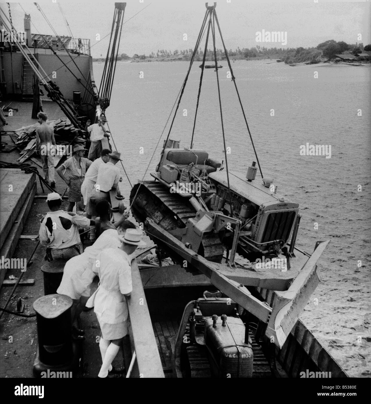 East African Groundnuts Scheme. Loading caterpillar tractors and road