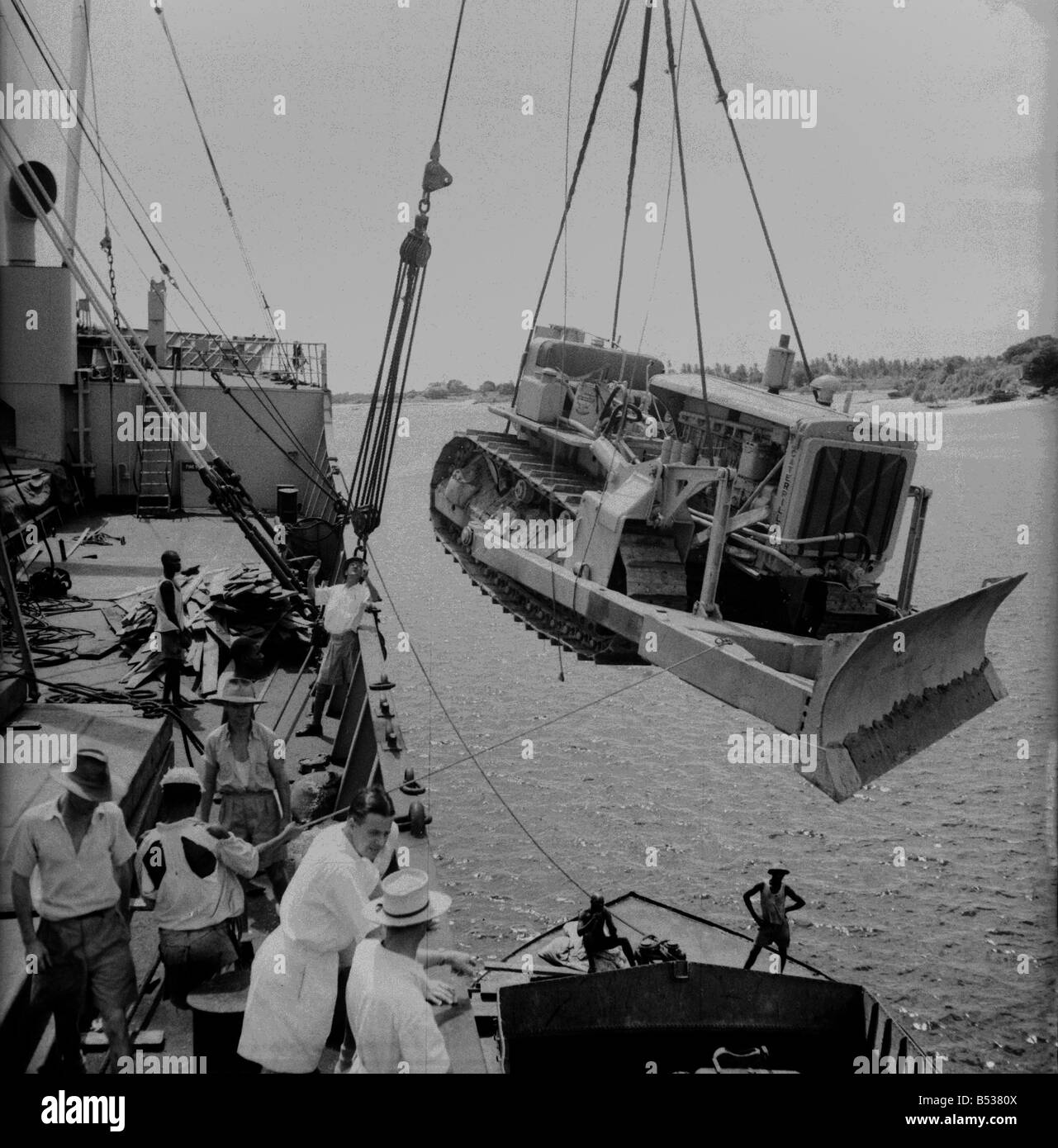 East African Groundnuts Scheme. Loading caterpillar tractors and road