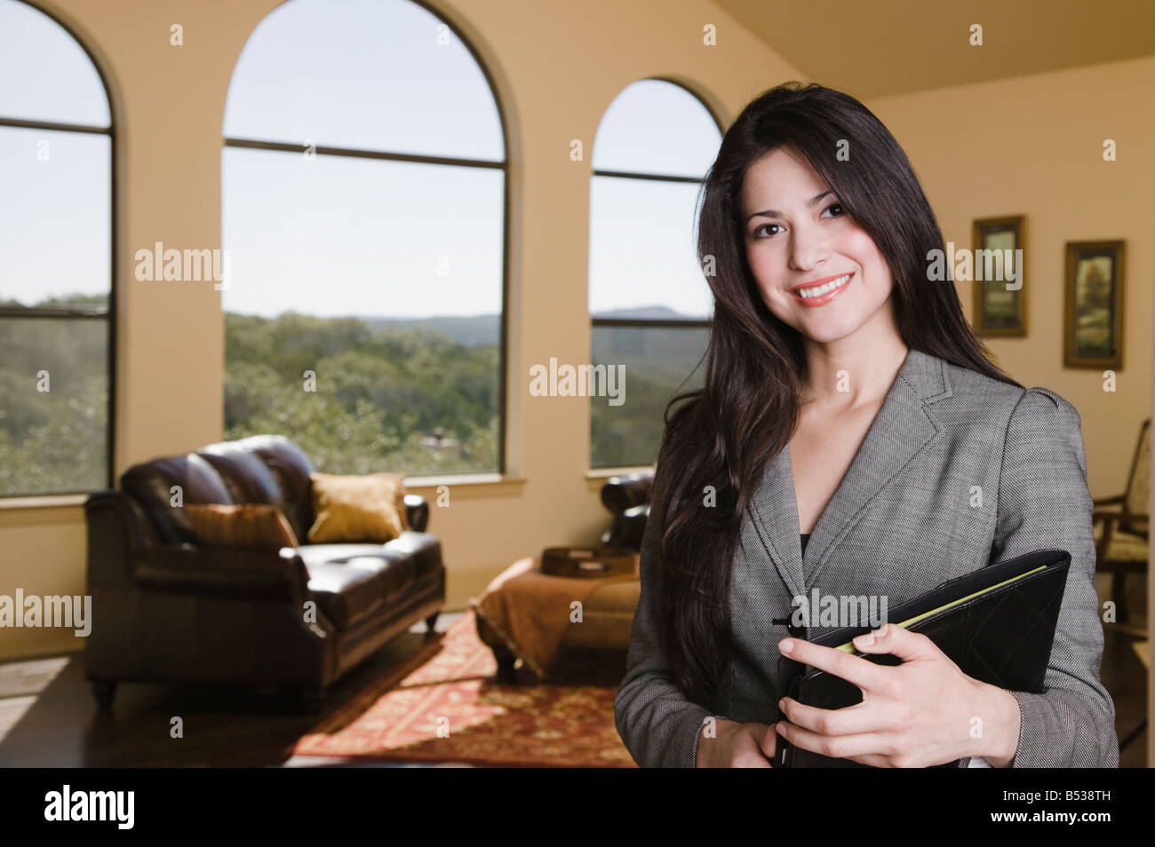 Hispanic real estate saleswoman Stock Photo