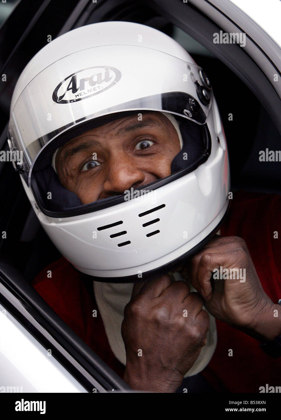 Drivers including ex footballers try out for the first Caribbeen Racing Team at Brands Hatch today Luther Blissett prepares to drive Stock Photo