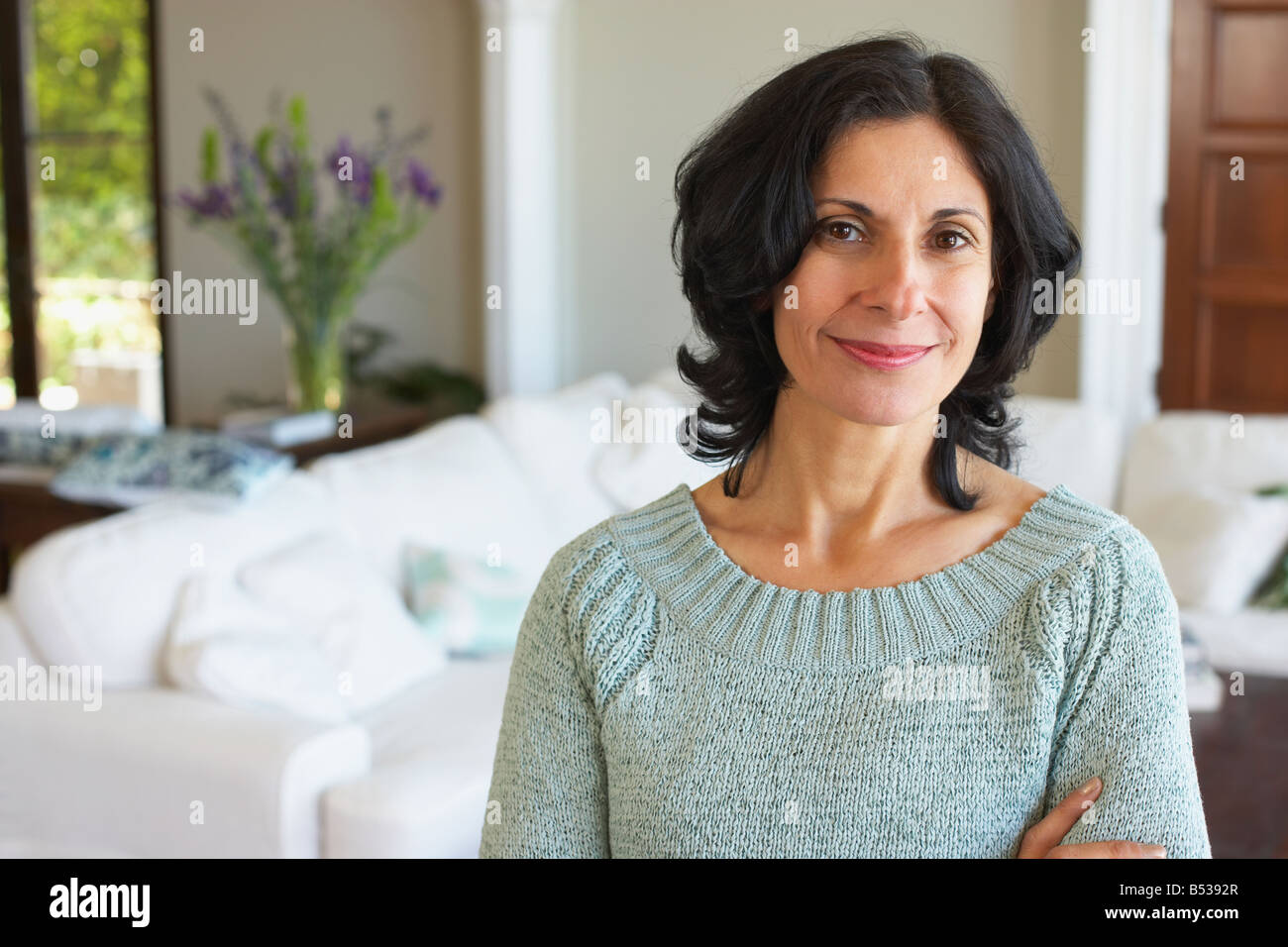 Confident Middle Eastern woman in living