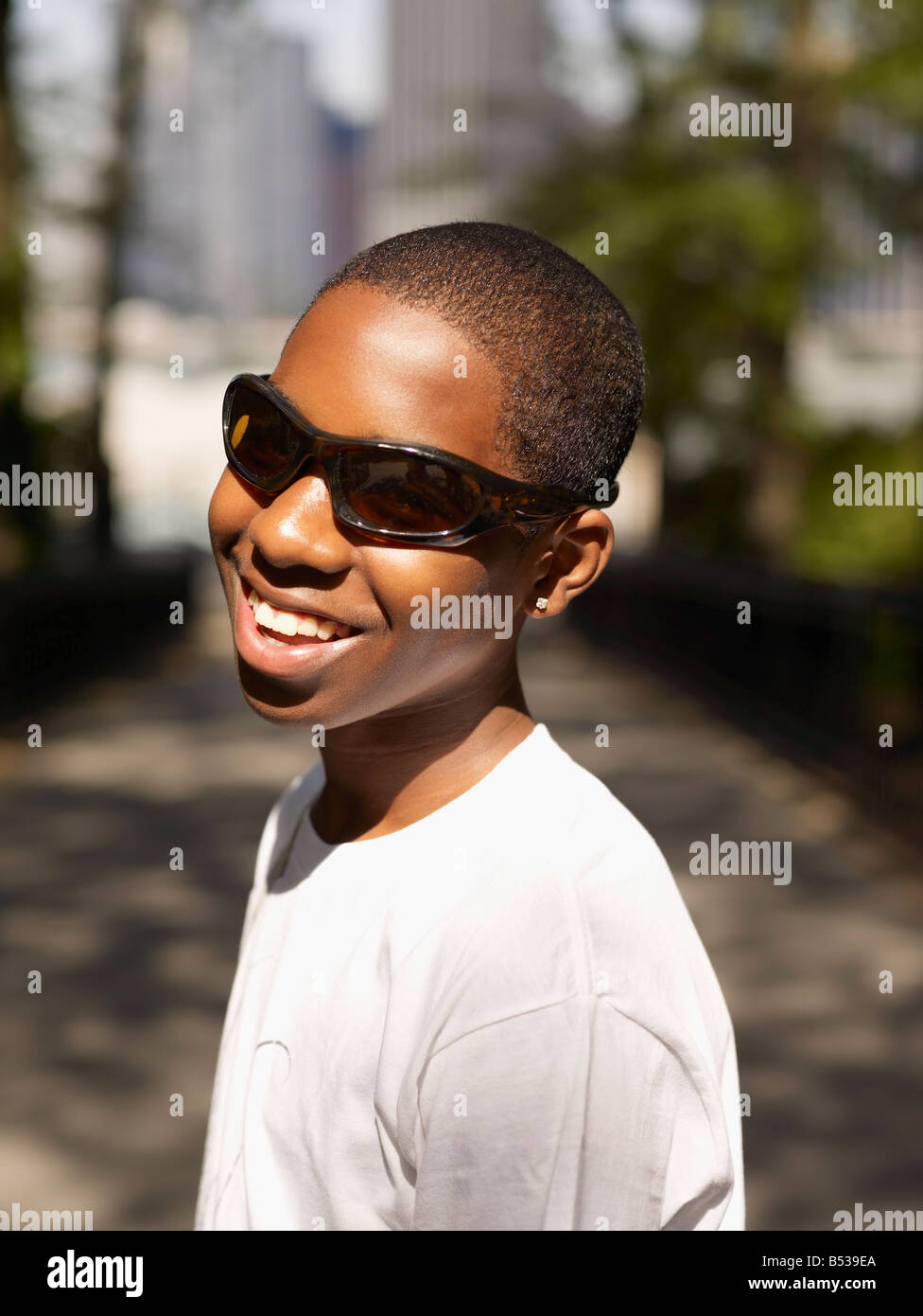 African teenage boy standing in urban park Stock Photo - Alamy