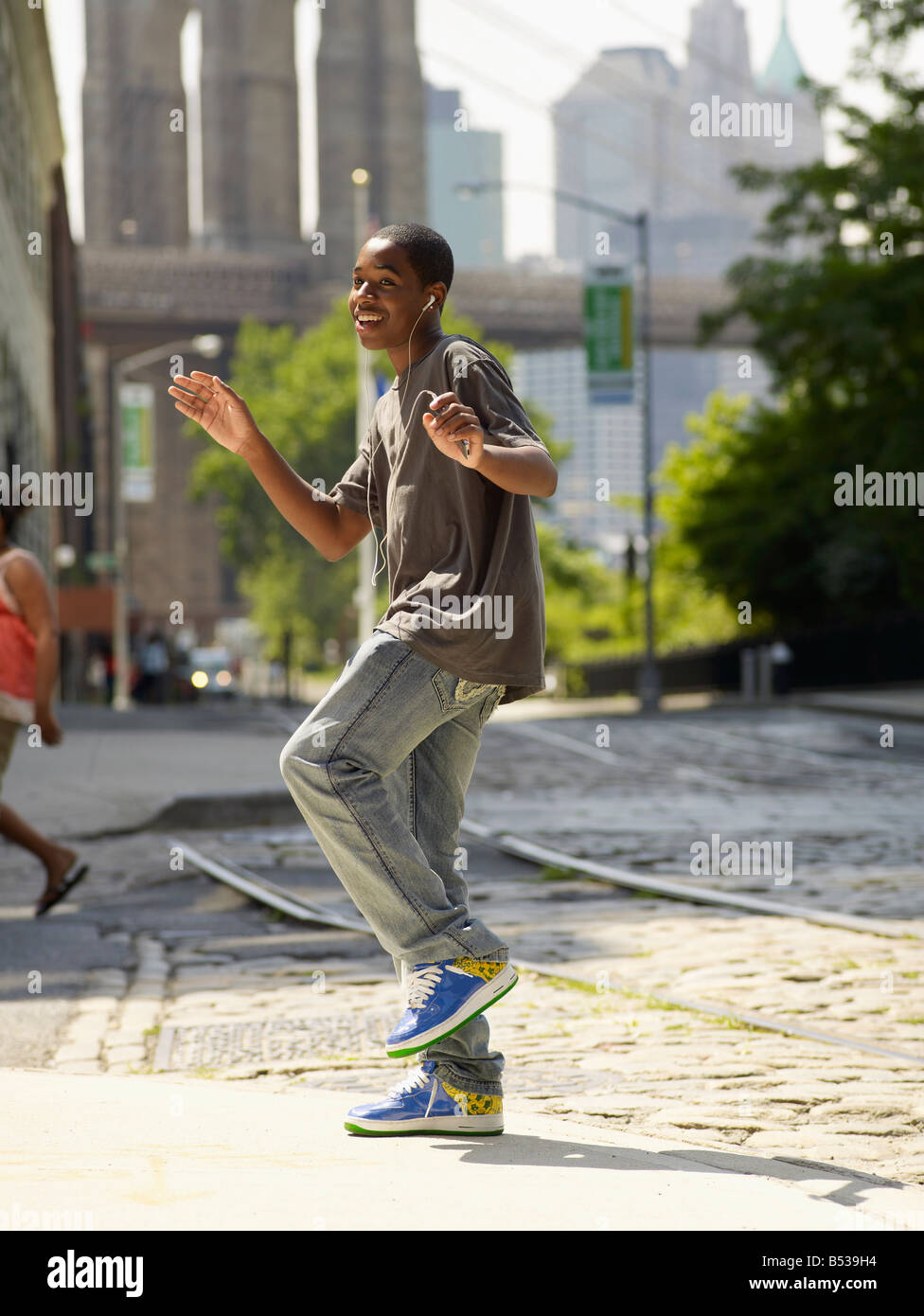 African boy dancing to music in urban setting Stock Photo Alamy