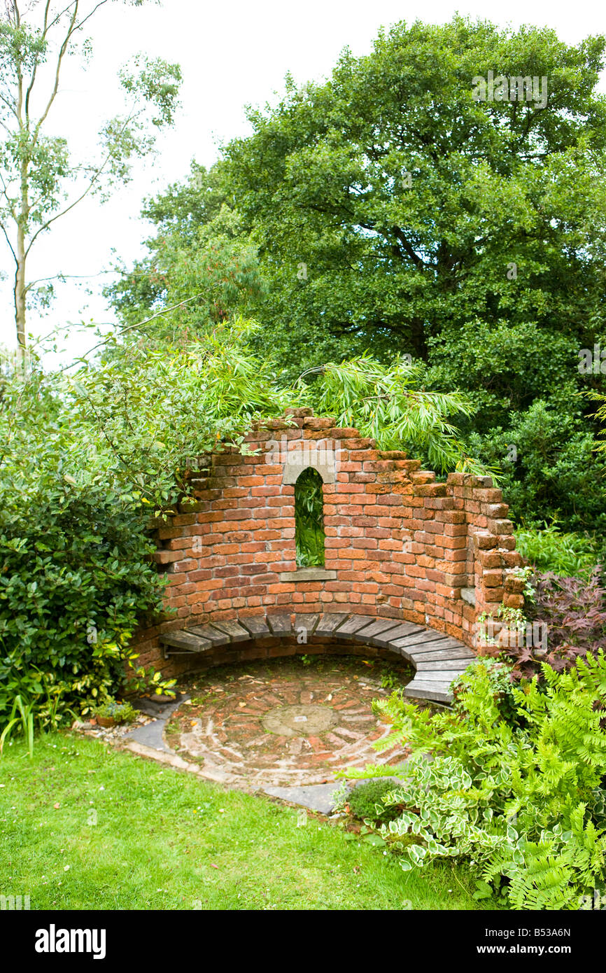 brick seating area in a large garden Stock Photo