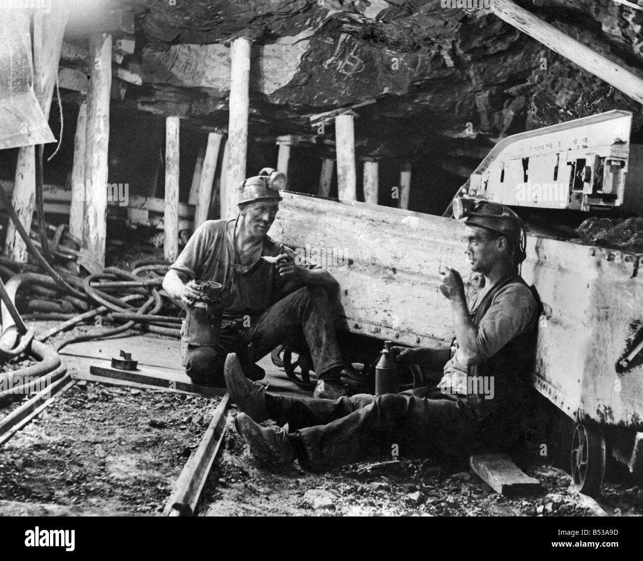 Coal Mines underground scenes. Workers having a break. &#13;&#10;December 1937 &#13;&#10;P017829 Stock Photo