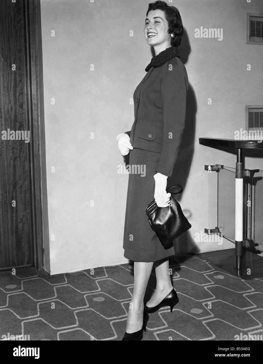 Diana Iles aged 21 of Downend, Bristol ;wearing a two-piece suit with no hat, white gloves Astrakan collar and holding a handbag. ;April 1957 ;P017936 Stock Photo