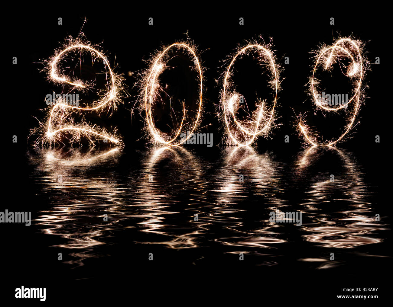 Inscription 2009 made by celebratory fireworks Reflection in water celebratory fireworks 2009 Stock Photo
