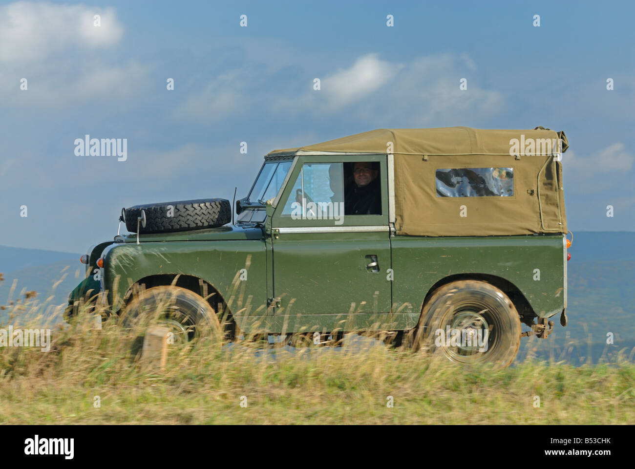 Green 1950/60s Land Rover Series 2 / 2a softtop on a forest track in the Weserbergland. Stock Photo