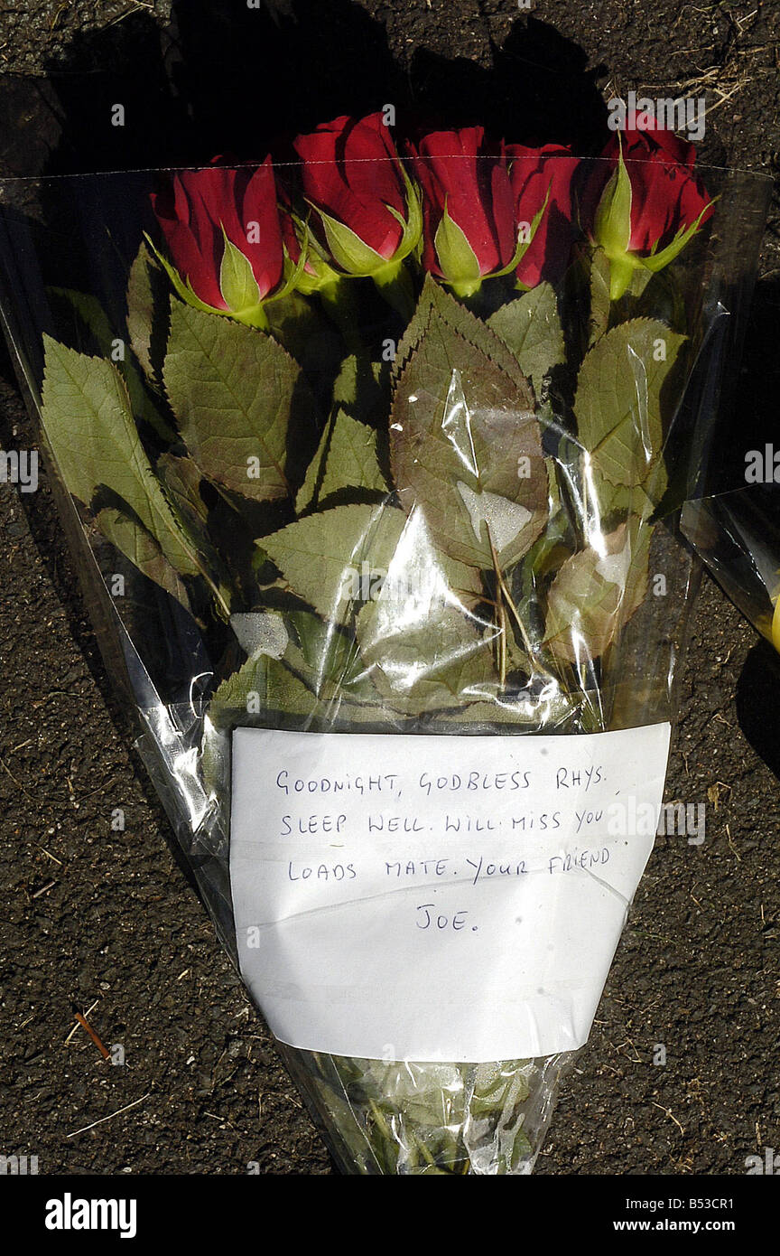 Floral tributes are laid in the car park of the Fir Tree Pub in