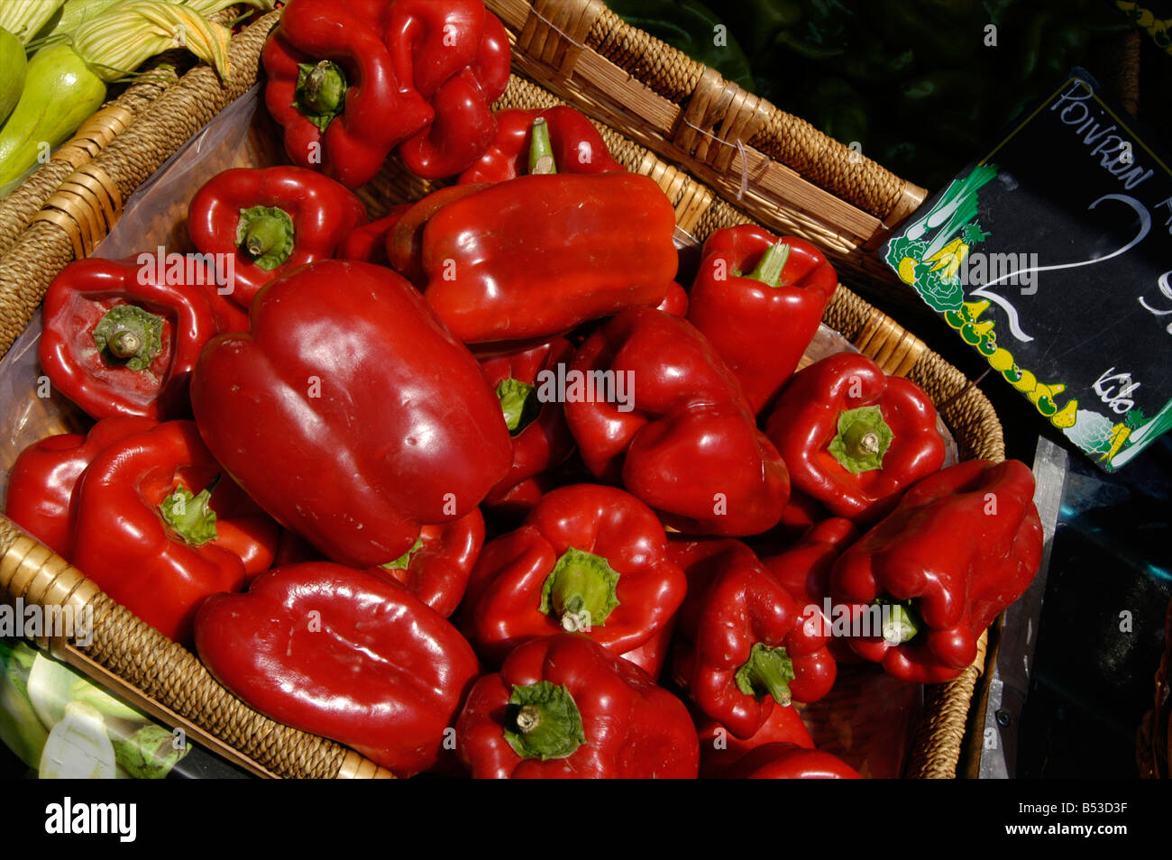 A tray of red peppers on a fresh vegetable stall in the Old Town market of Nice in the South of France Stock Photo