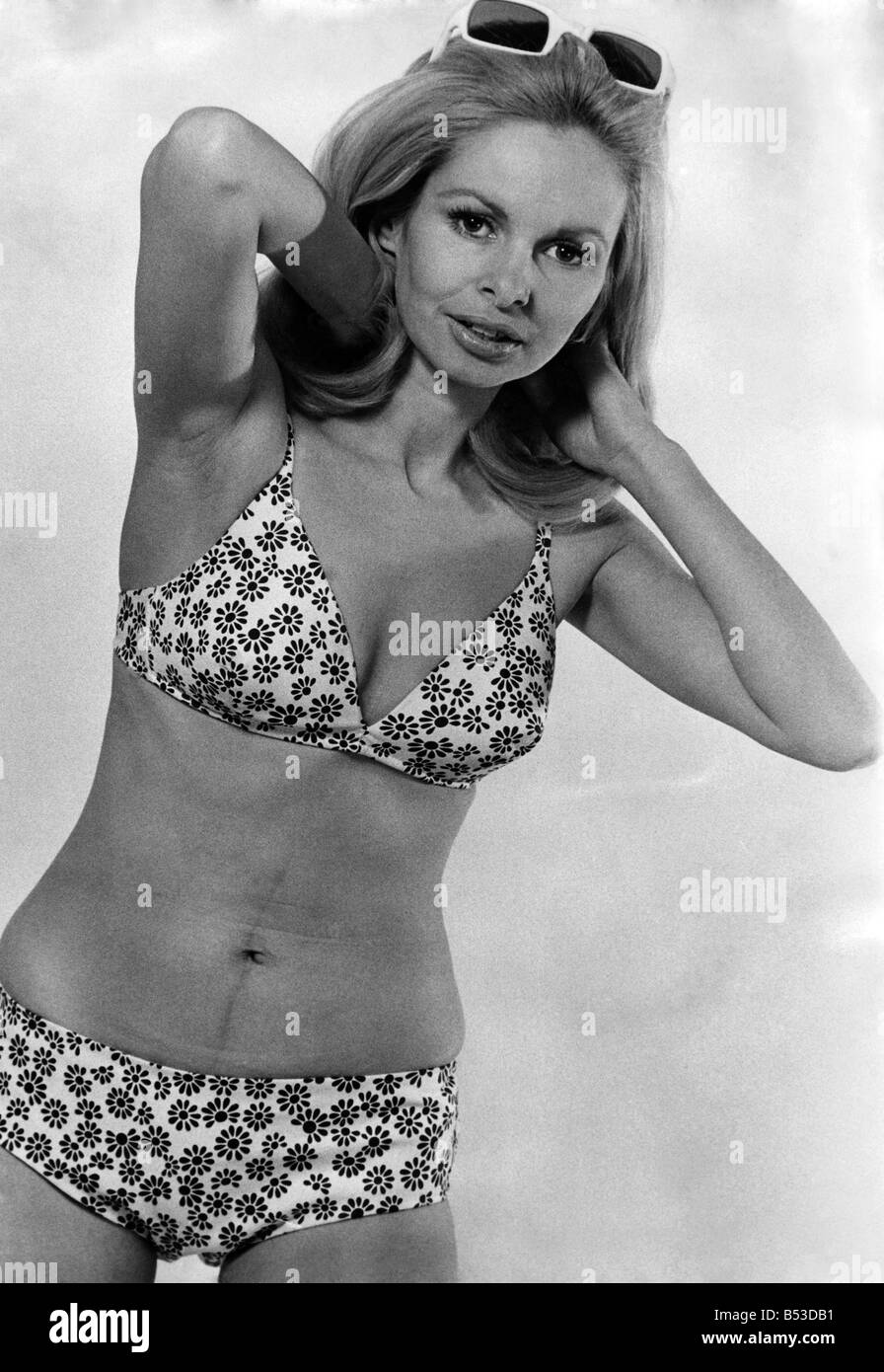 Price-conscious bikini with a deep diving plunge. By Dorothy Perkins in a  navy and white daisy print. ;March 1970 ;P017607 Stock Photo - Alamy