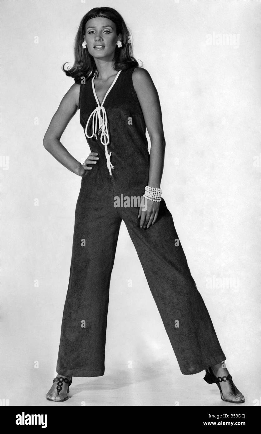 Bright blue towelling jumpsuit, trimmed with white at the V-neck and with white cord lacing up the front. By Jersea of Sweden. ;May 1969 ;P17630 Stock Photo